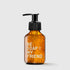 Amber pump bottle of hand and body soap with white "Be Soap My Friend" text and visible soap bubbles.