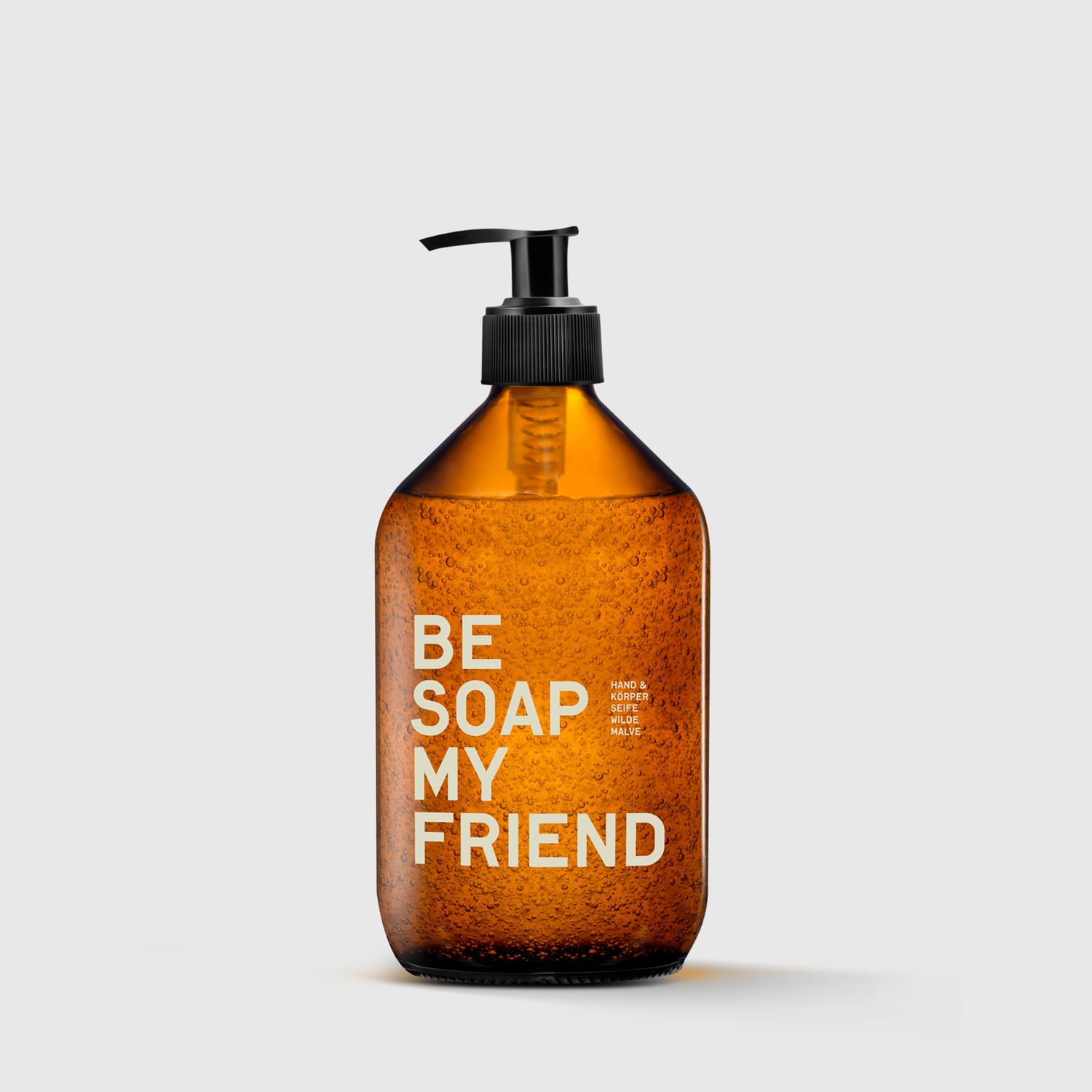 Amber textured glass bottle of Be Soap My Friend hand and body soap with black pump dispenser.