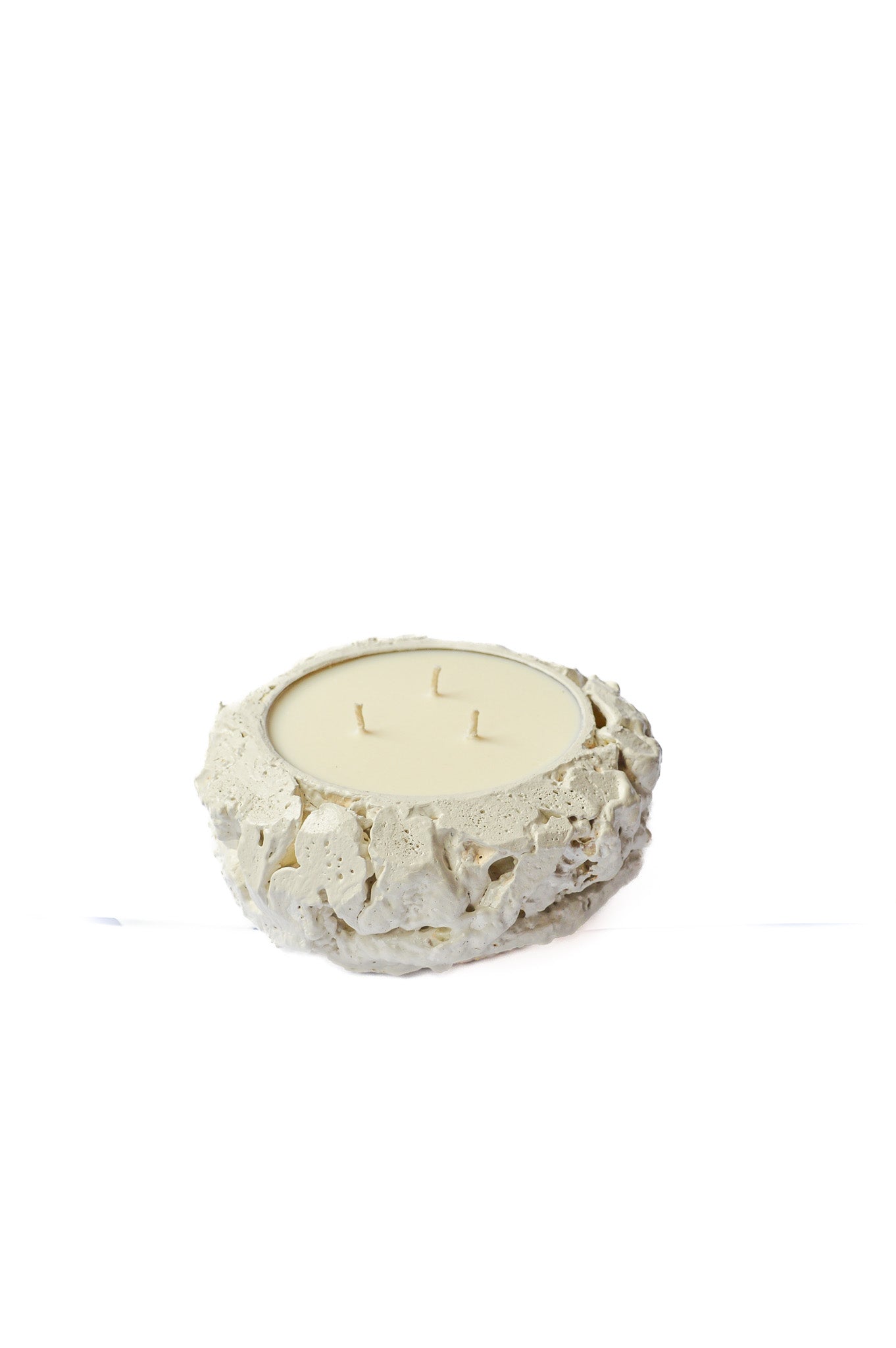 Round white textured ceramic candle holder with three unlit wicks, 500ml size.