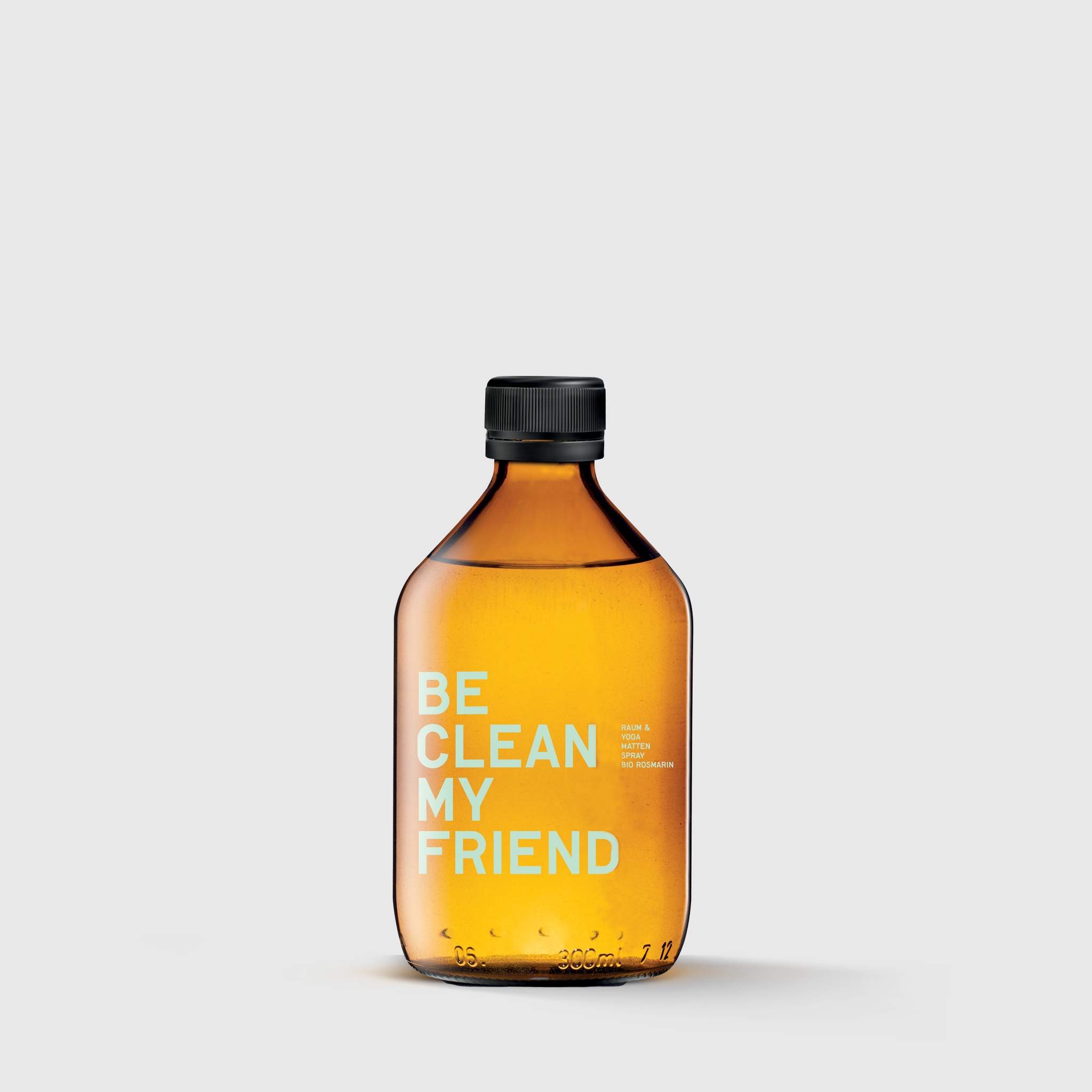 Amber glass spray bottle with black cap and white "BE CLEAN MY FRIEND" text label.