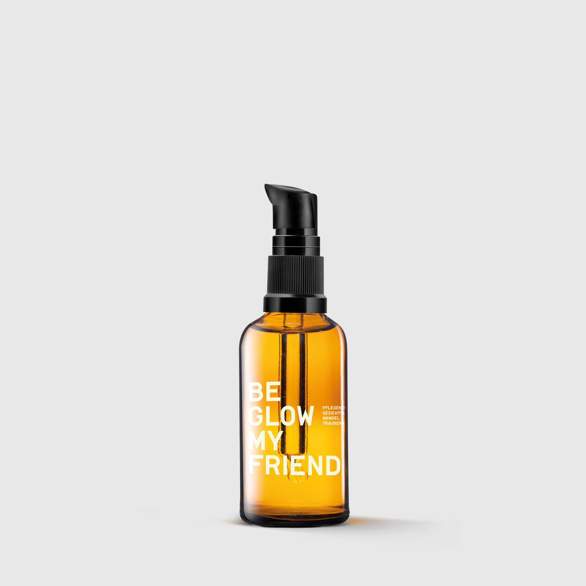 Amber glass bottle with black pump labeled "Be Glow My Friend" face oil, 50ml.