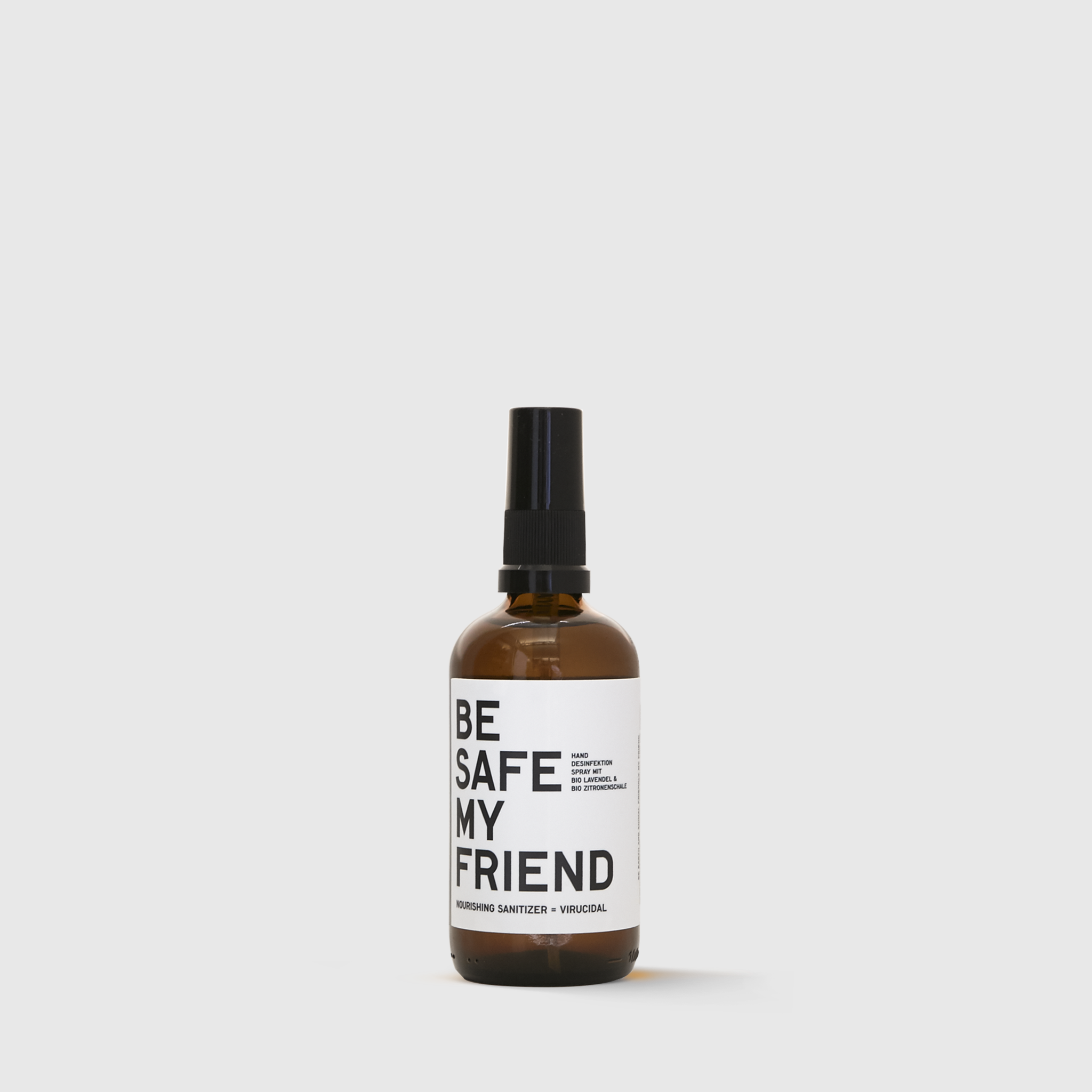 Amber glass spray bottle with black cap and white label reading "BE SAFE MY FRIEND".