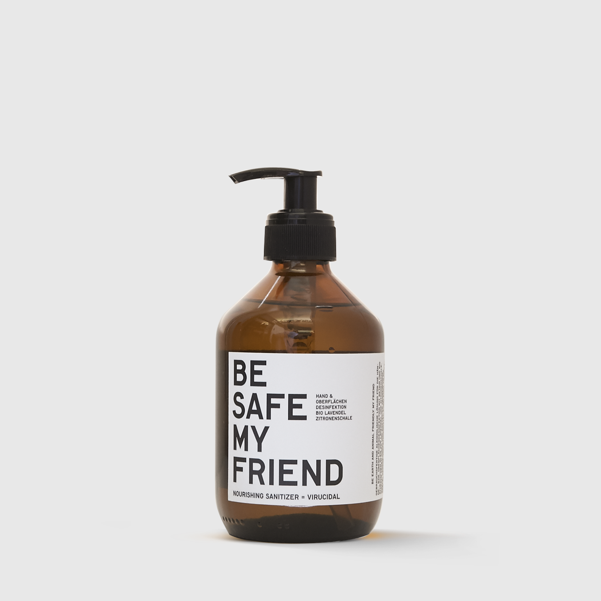 Amber plastic bottle with black pump dispenser labeled "Be Safe My Friend" hand sanitizer.