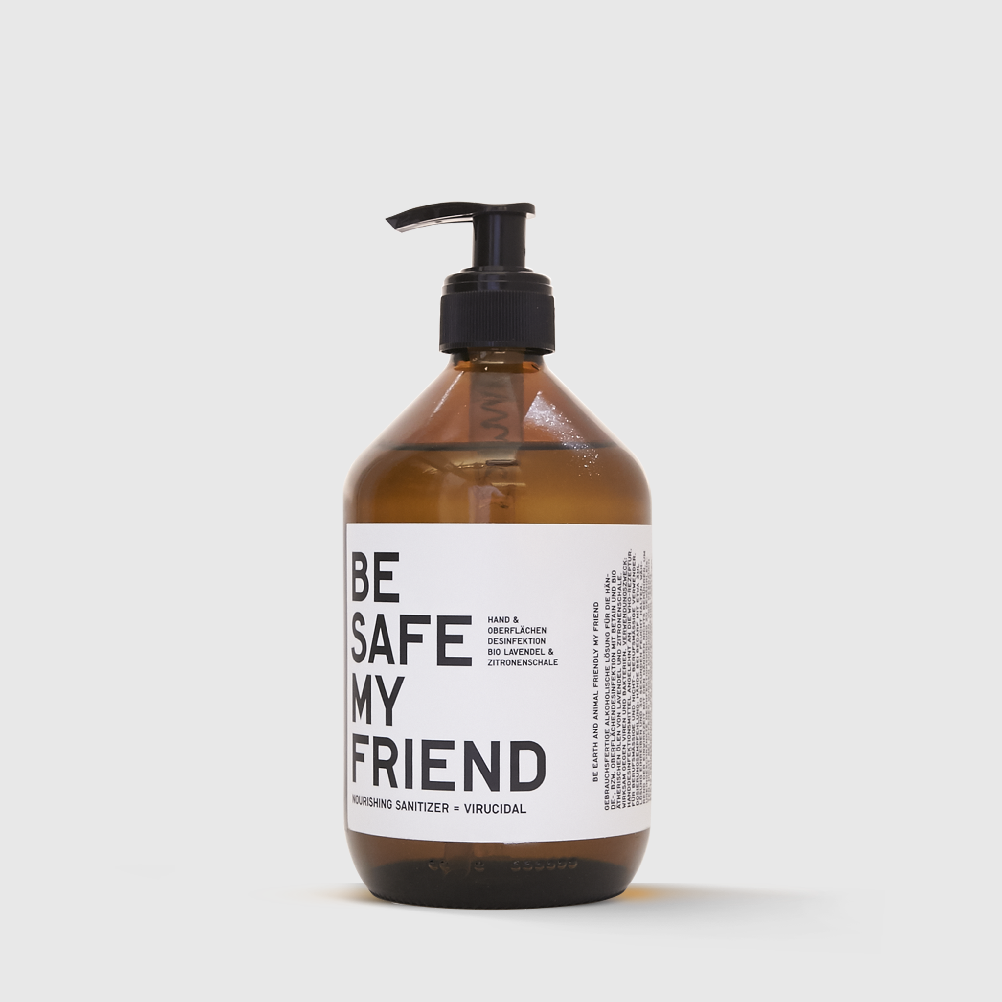 Amber pump bottle of Be Safe My Friend hand sanitizer with minimal black and white label design.
