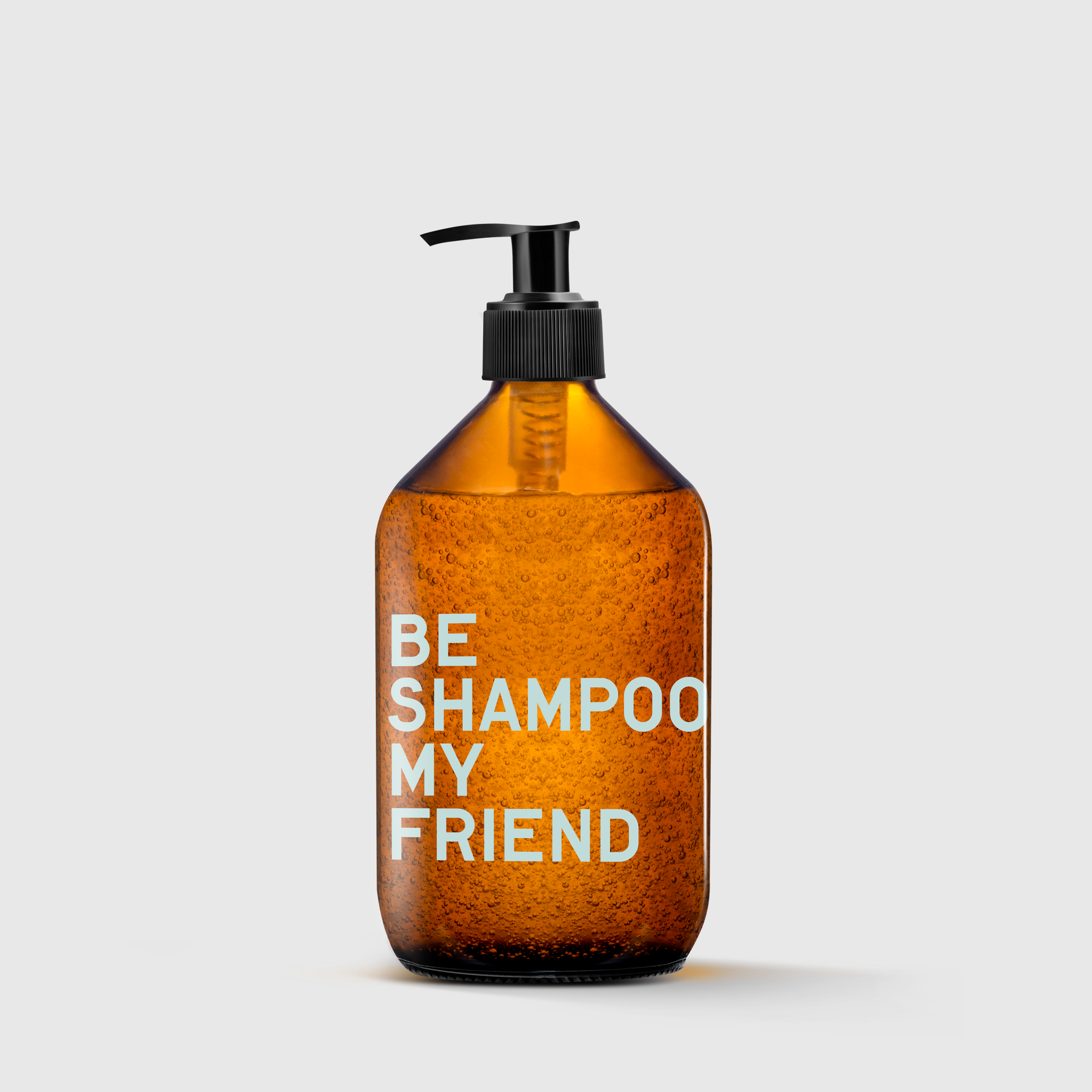 Amber pump bottle with white text "BE SHAMPOO MY FRIEND" on front.