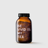 Amber glass jar filled with loose herbal tea labeled "Be Vivid My Tea" with black screw cap.