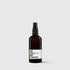 Brown glass spray bottle with black nozzle and white label reading BE SOLO MY FRIEND.